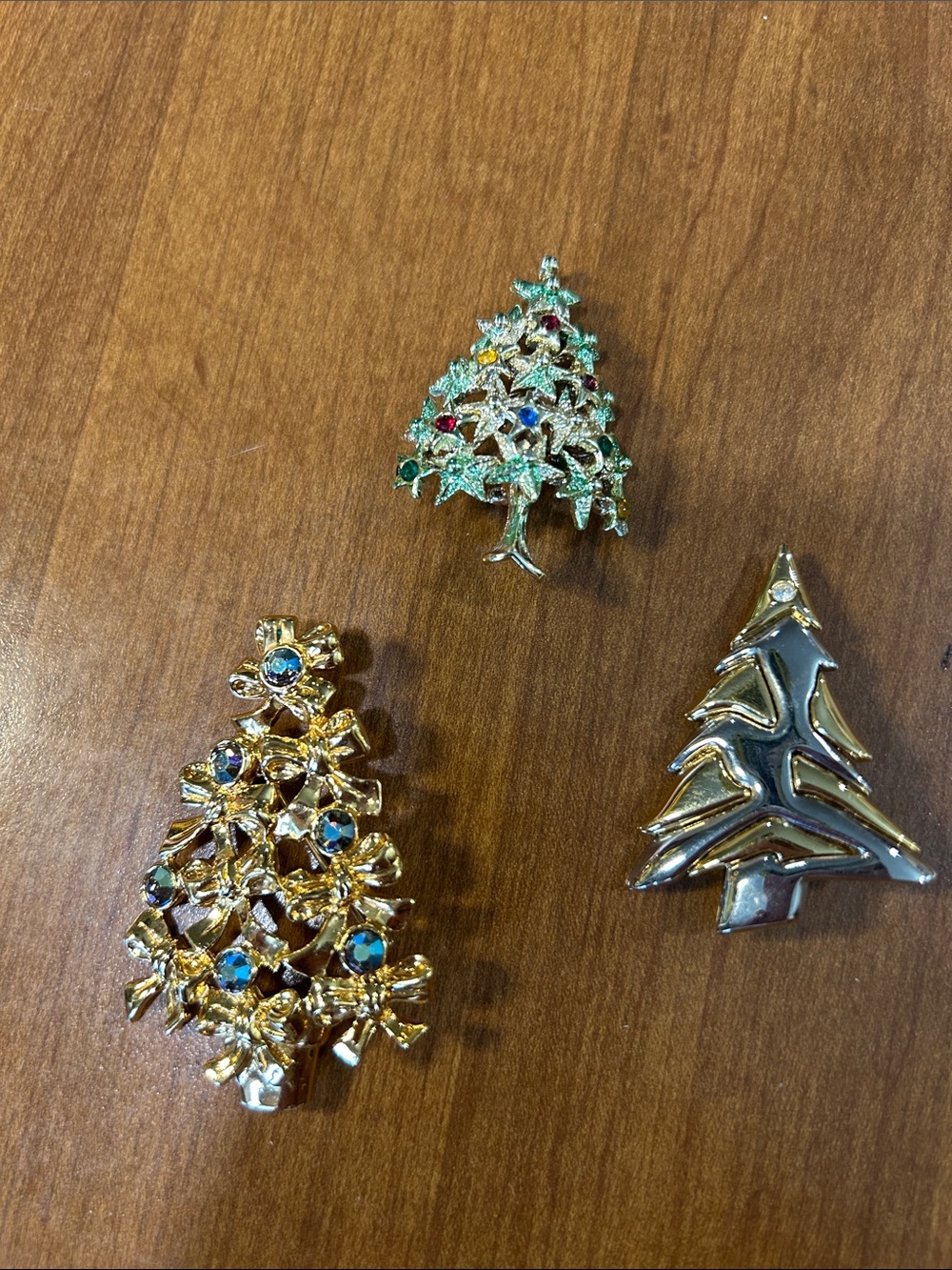 Three Christmas Tree brooches
